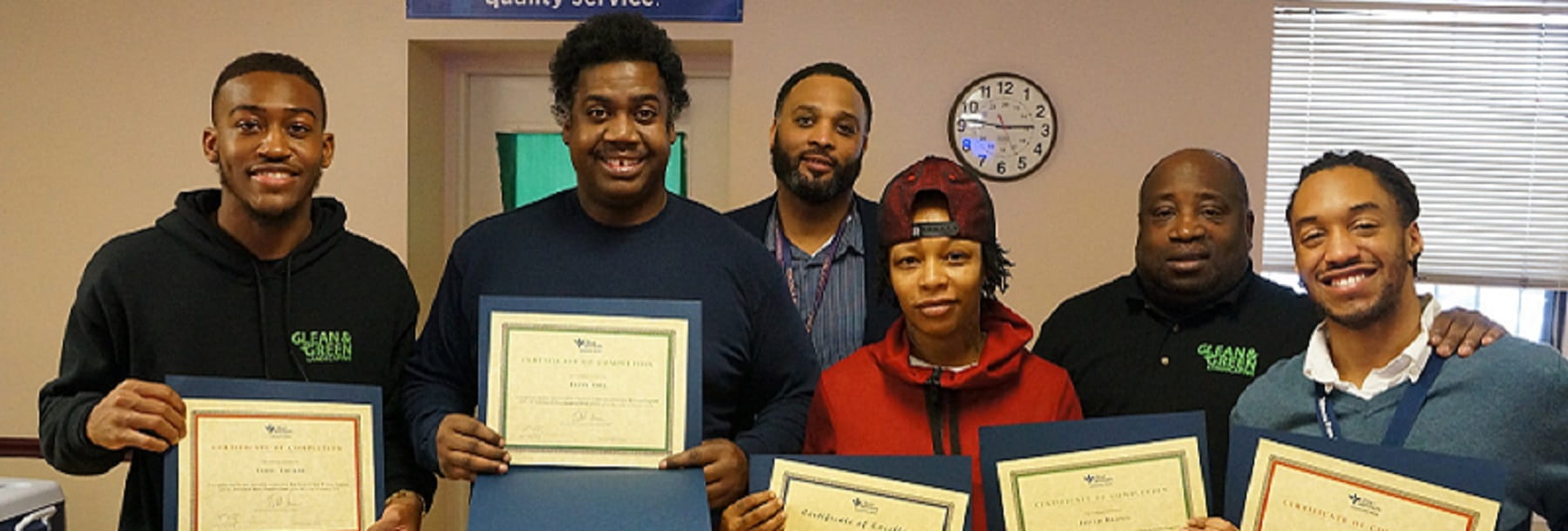 group photo of Bon Secours Community Works economic development program holding up certificates